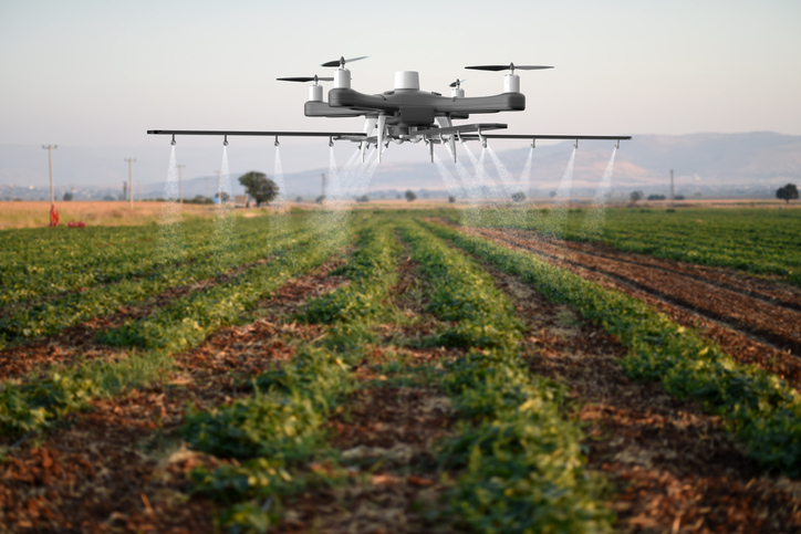drone crop dusting in fields